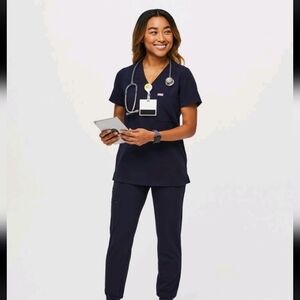 FIGS Catarina One-Pocket scrub top and Zamora jogger scrub pants. Navy Blue